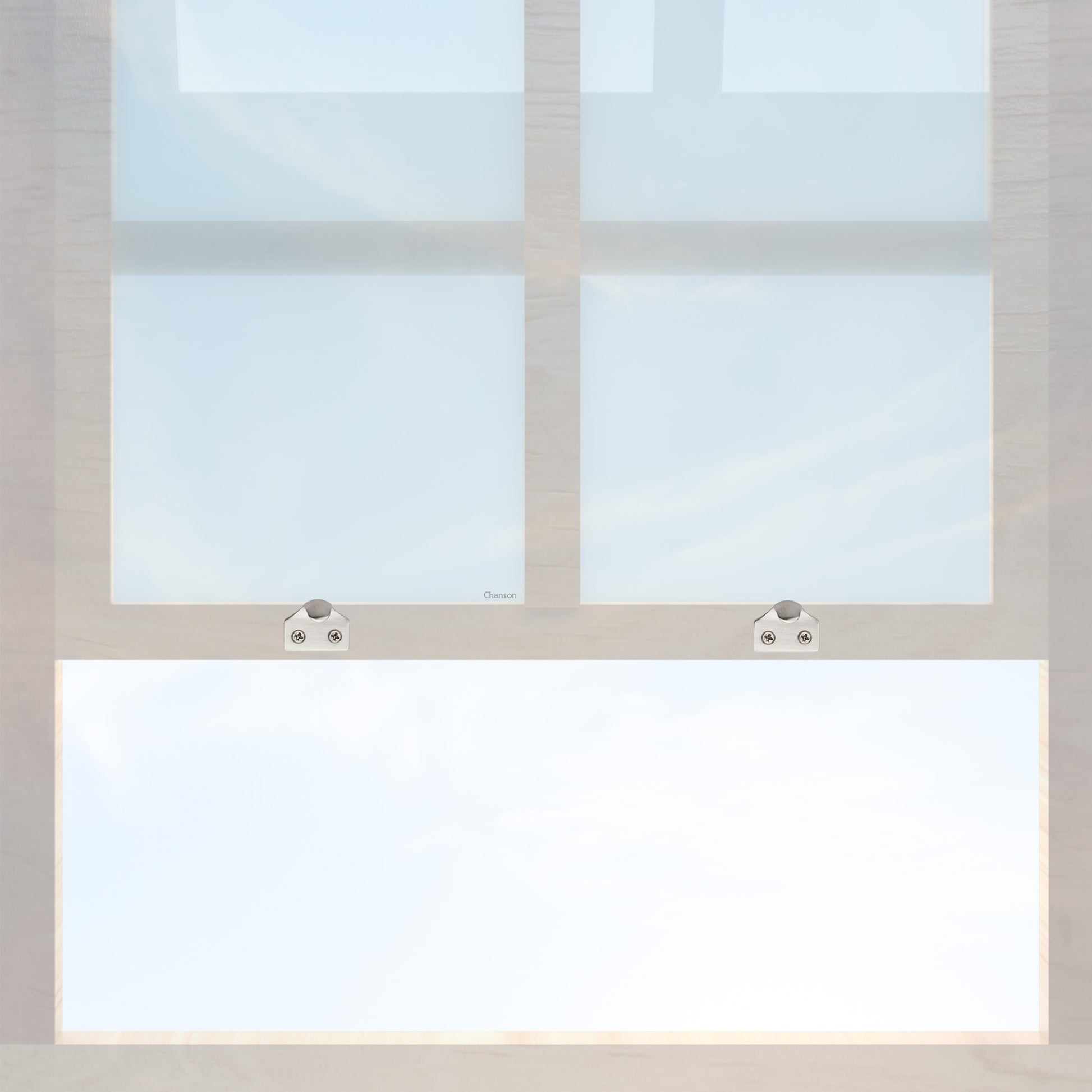 A wooden sash window with a pair of chanson hardware solid brass sash lifts that have a hook type design and a satin nickel finish