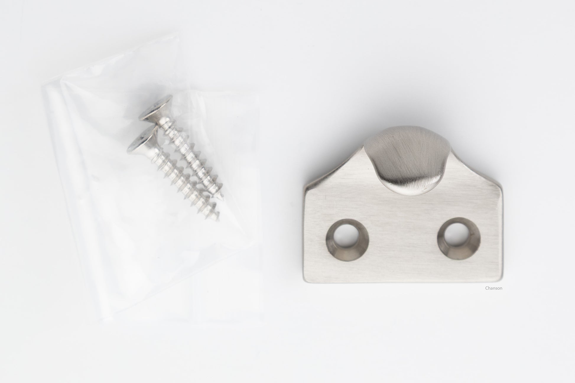 A classic traditional simple solid brass hook type sash window lift in satin or brushed nickel US15 finish, along with finish matching screws