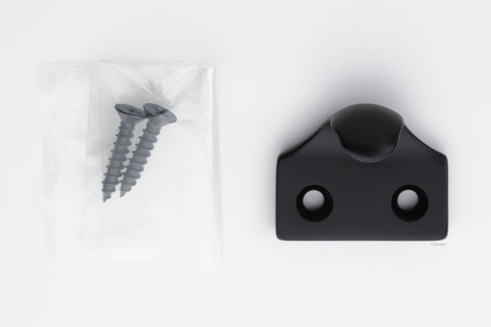 A classic traditional simple solid brass hook type sash window lift in flat or matte black US19 finish, along with finish matching screws