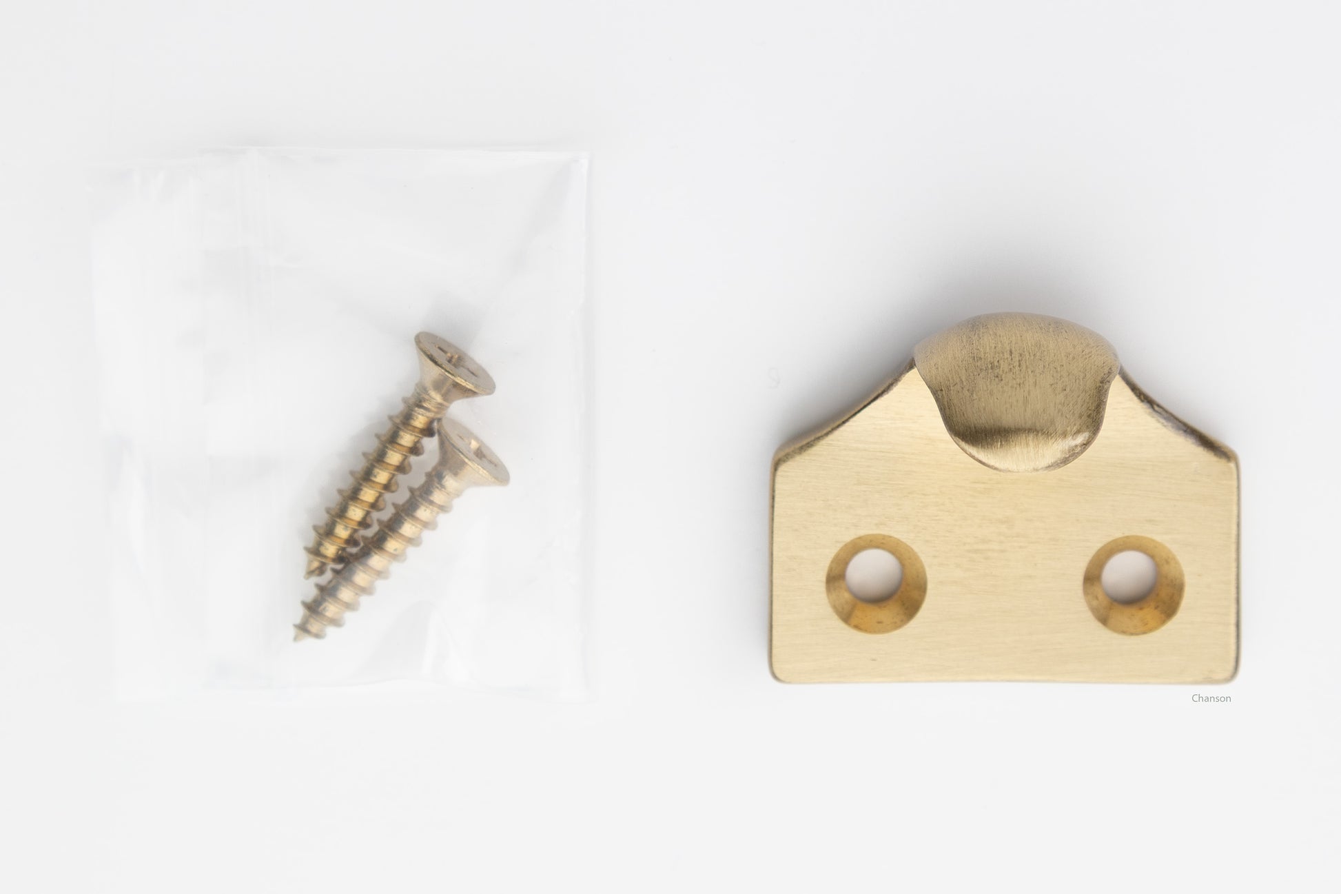 A classic traditional simple solid brass hook type sash window lift in satin brass US4 finish, along with finish matching screws