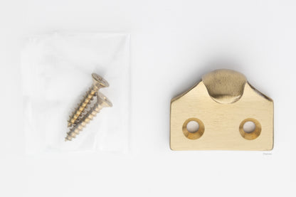 A classic traditional simple solid brass hook type sash window lift in satin brass US4 finish, along with finish matching screws