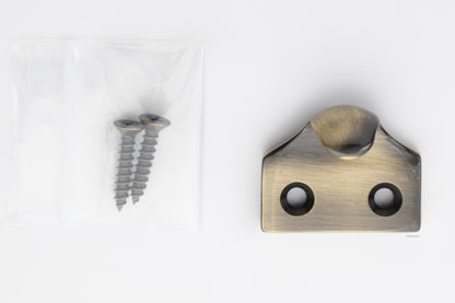 A classic traditional simple solid brass hook type sash window lift in antique brass US5 finish, along with finish matching screws