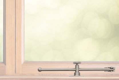 A sliding rod design solid brass casement adjustable stay with knob adjuster that is installed on the bottom sill or ledge of a outward swing window, shown in satin nickel finish